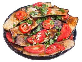 fried eggplants with red tomato and garlic photo