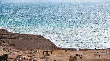 view of beach of Dead Sea from Jordan in winter photo