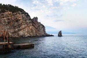 view of pier and Parus Sail rock in Black Sea photo