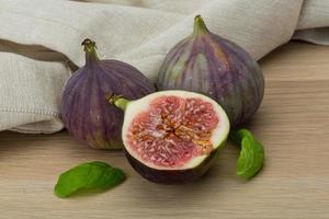 Figs on wooden background photo