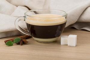 Cappuccino on wooden background photo