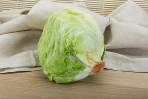 iceberg salad on wooden background photo