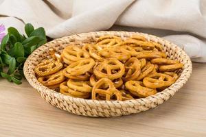 Pretzel in a basket on wooden background photo