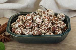 Peanut in honey with sesame seeds photo