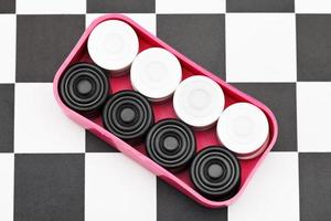 box with checkers on checkerboard photo