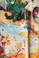 paintbrush on wooden oils artistic palette photo