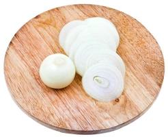 bulb and sliced onions on wooden cutting board photo