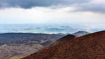 lava fields on Mount Etna and Ionian Sea coast photo