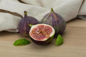 Figs on wooden background photo