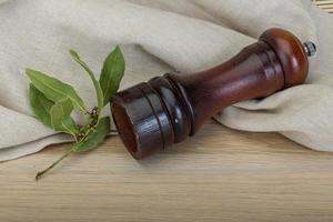 Pepper mill with laurel photo