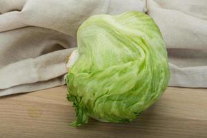 iceberg salad on wooden background photo