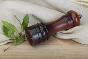 Pepper mill with laurel photo