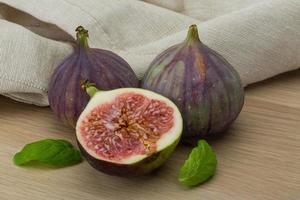 Figs on wooden background photo