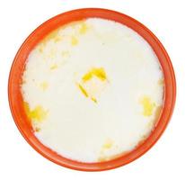 top view of semolina porridge with melting butter photo