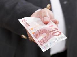 front view of ten euro banknote in male hand photo