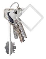 bunch of house keys on ring and keychain photo