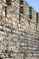 tourists on wall of Castle in Tavira city photo