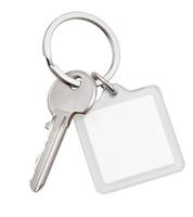 one house key and square keychain on ring photo