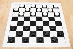 Starting position on vinyl draughts board photo