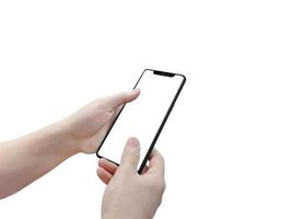 Closeup shot of a woman typing on mobile phone isolated on white background.. Girl's hand holding a modern smartphone and pointing with figer. Blank screen to put it on your own webpage or message. photo
