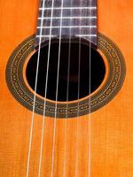 sound hole of spanish acoustic guitar close up photo