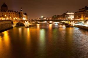 night panorama of Seine river in Paris photo