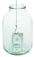 one dollar money and fishhook in glass jar photo