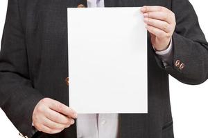 trainer holds blank sheet of paper in hands photo