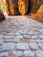 stone pavement of Al Siq passage to ancient Petra photo