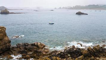 boat near coast of English Channel in Brittany photo