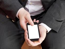 above view of smartphone in businessman hand photo