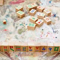 wooden tiles on player hand in mahjong game photo