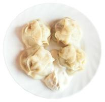 above view of manti dumpling on plate isolated photo