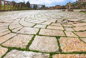 wet pavement of Oval Forum in Jerash in winter photo