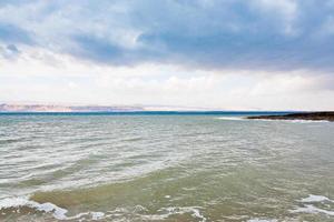 Dead Sea in cloudy day photo