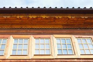 windows of wooden log house photo