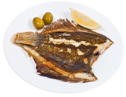 fried sole fish on white background photo