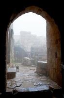 entrance in medieval Ajlun Castle in foggy day photo