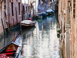 canal, gondola, boats in Venice, Italy photo