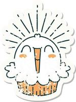 worn old sticker of a tattoo style happy singing cupcake vector