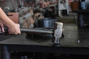 A portrait of some people holding hand tool maintenance. Such as hummer. photo