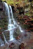 Autumn waterfal and stones photo