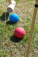 game of croquet on green lawn photo