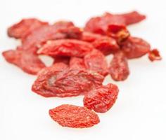 Dried goji berries close up on whit photo