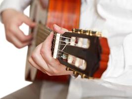 man plays on classical acoustic guitar isolated photo