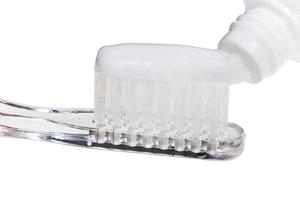 toothbrush and toothpaste from tube isolated photo