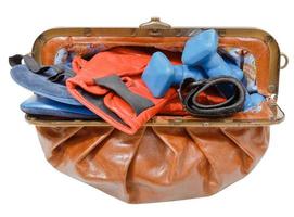 purse with sport boxing gloves and dumbbells photo