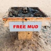 Tray with medical mud on beach of Dead Sea photo