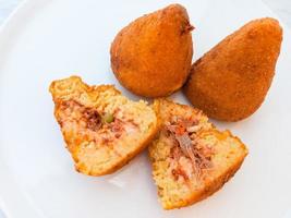 local meal arancini on white plate in Sicily photo