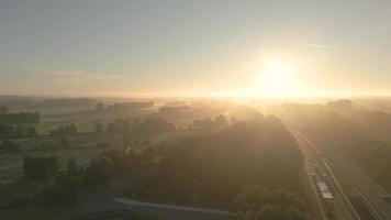 Sun light shines over foggy landscape video